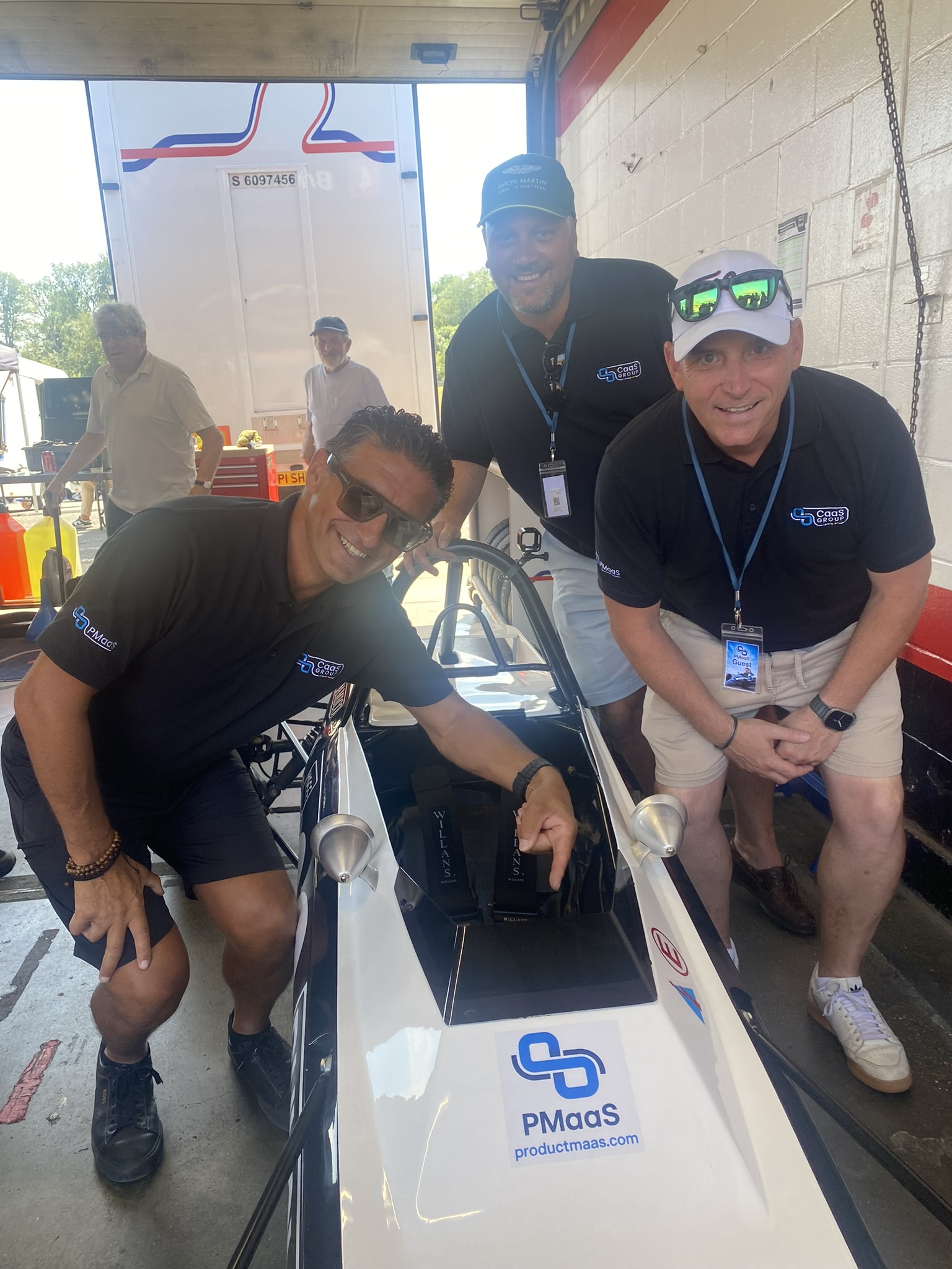 PMaaS and CaaS Group guests beside a Classic Formula Ford car